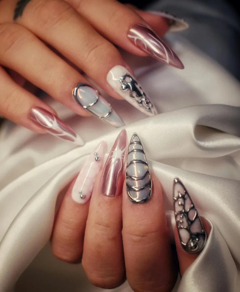 Long stiletto nails with chrome and ornate line art